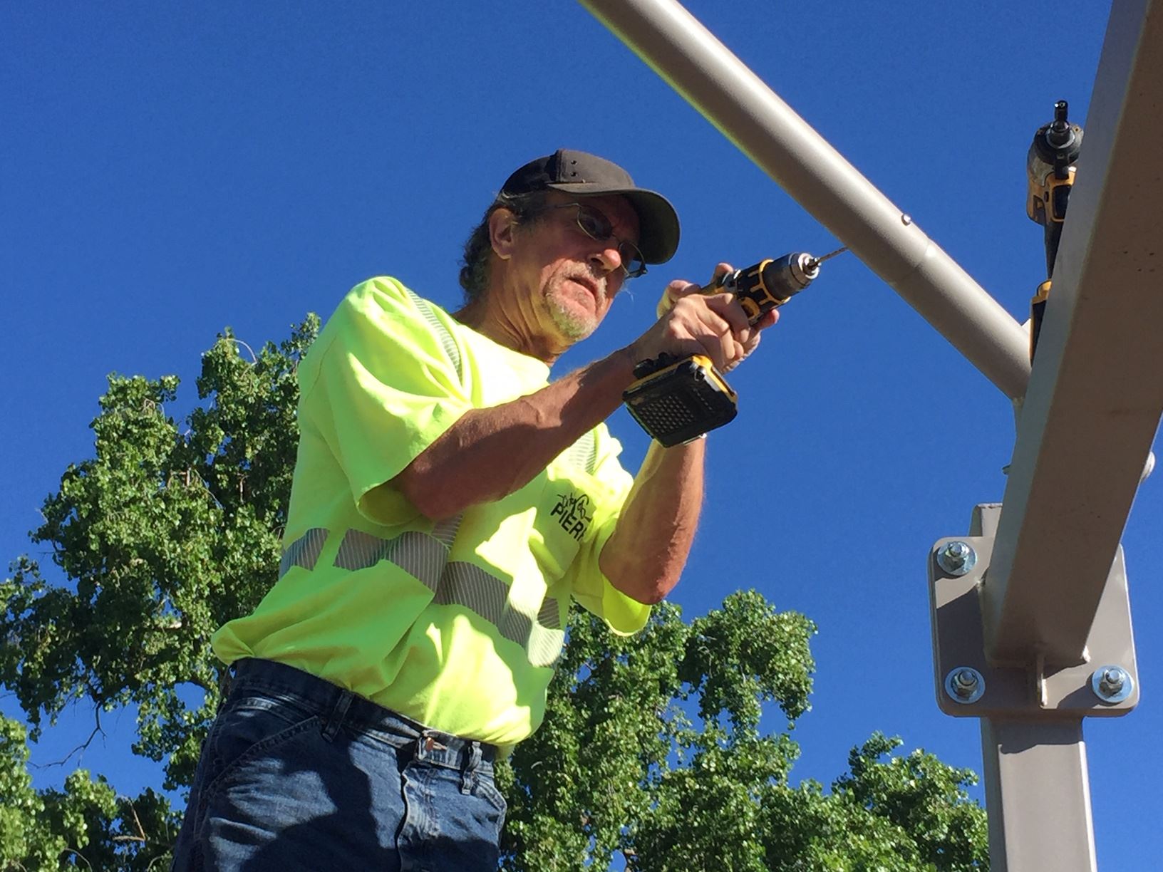 City carpenter installs shade structure