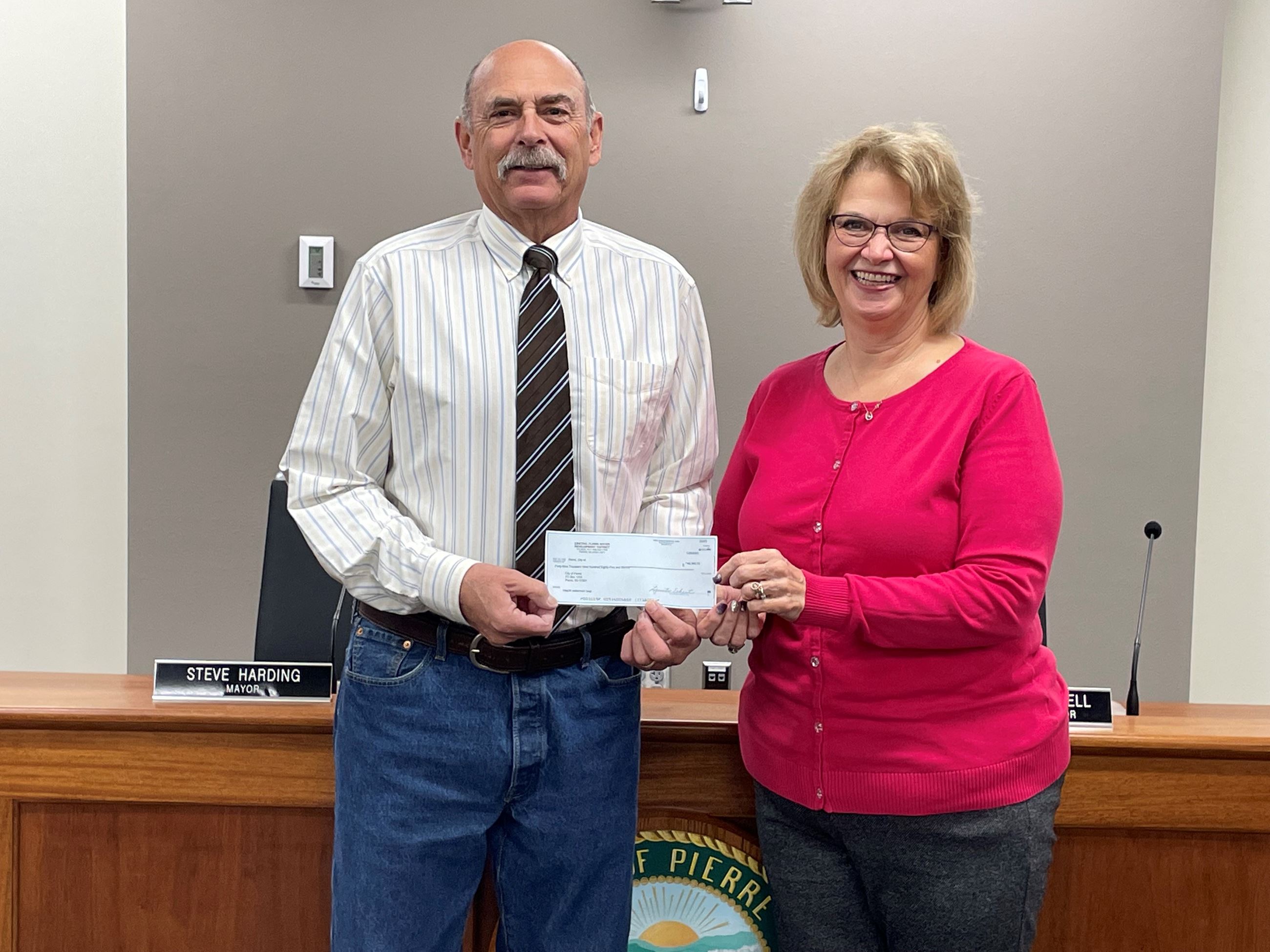 Check presentation between Mayor Harding and Water District Rep. Lynetter Eckert